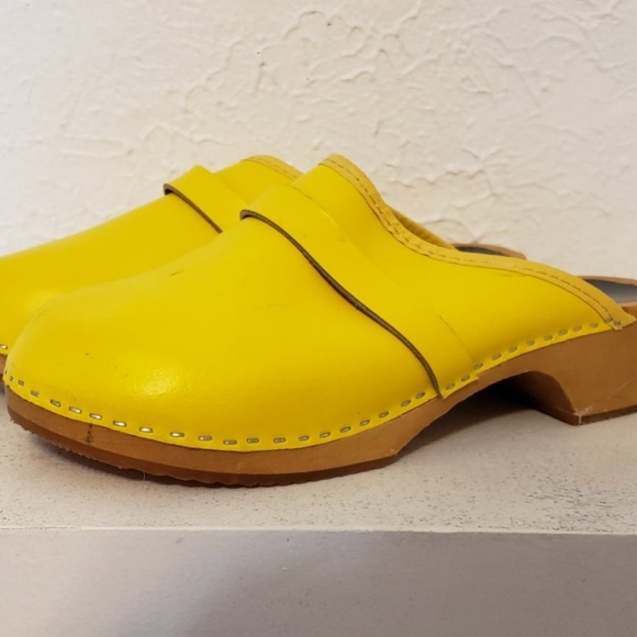 yellow wooden clogs
